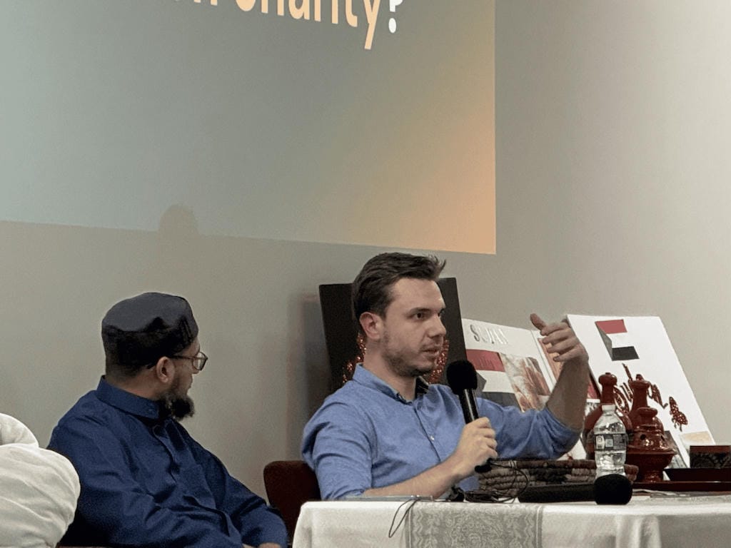 Afterfund co-founder Dzanan speaking to IOST community, with Anas Shaikh next to him.